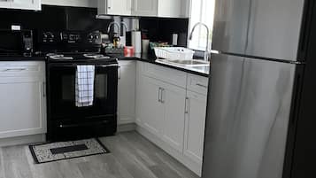 Fridge, microwave, stovetop, coffee/tea maker