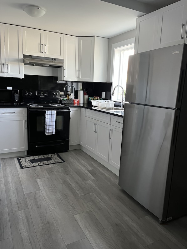 Fridge, microwave, stovetop, coffee/tea maker