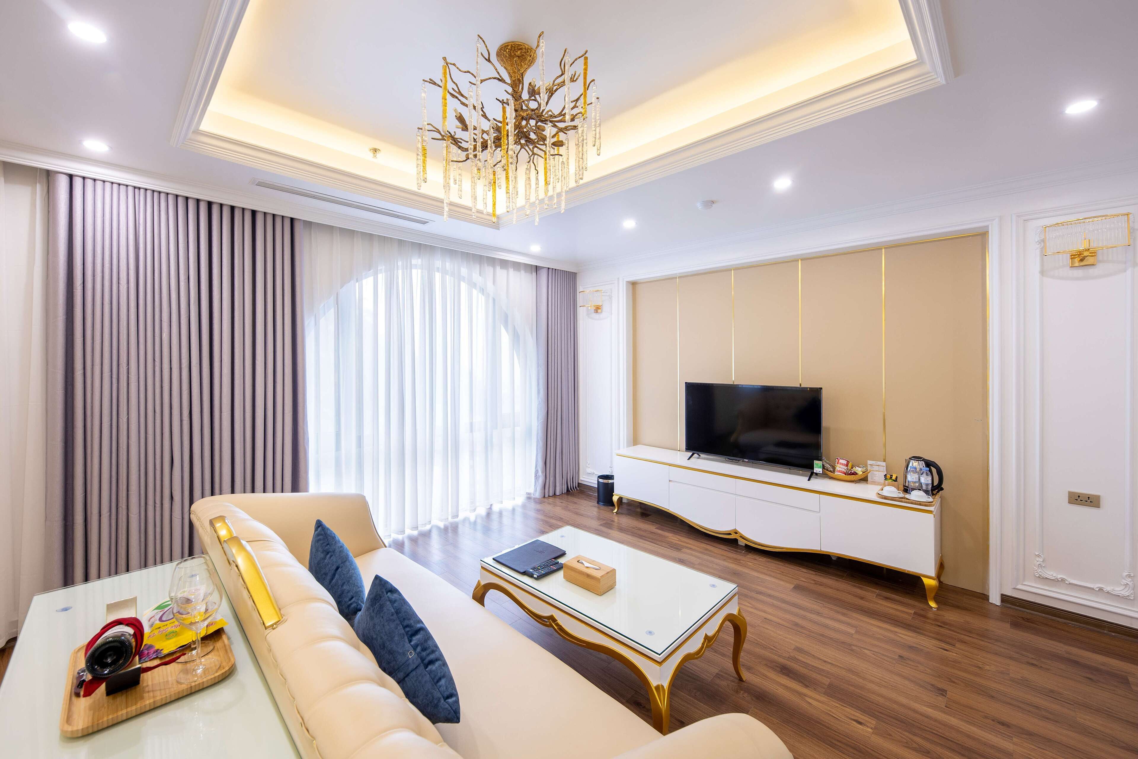 A modern living room with a sofa, coffee table, and a television.