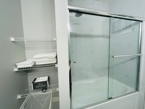 Combined shower/tub, hair dryer, towels, soap