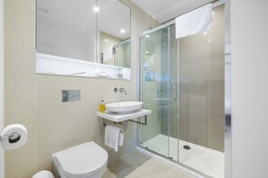 Bathtub, hair dryer, towels, soap