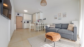 Appartement (10) | Woonruimte | Een plasmatelevisie