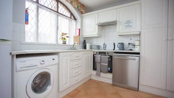 Microwave, dishwasher, highchair, cookware/dishes/utensils