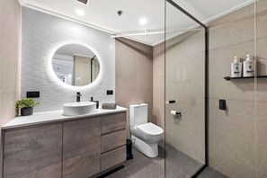 Shower, hair dryer, towels, soap