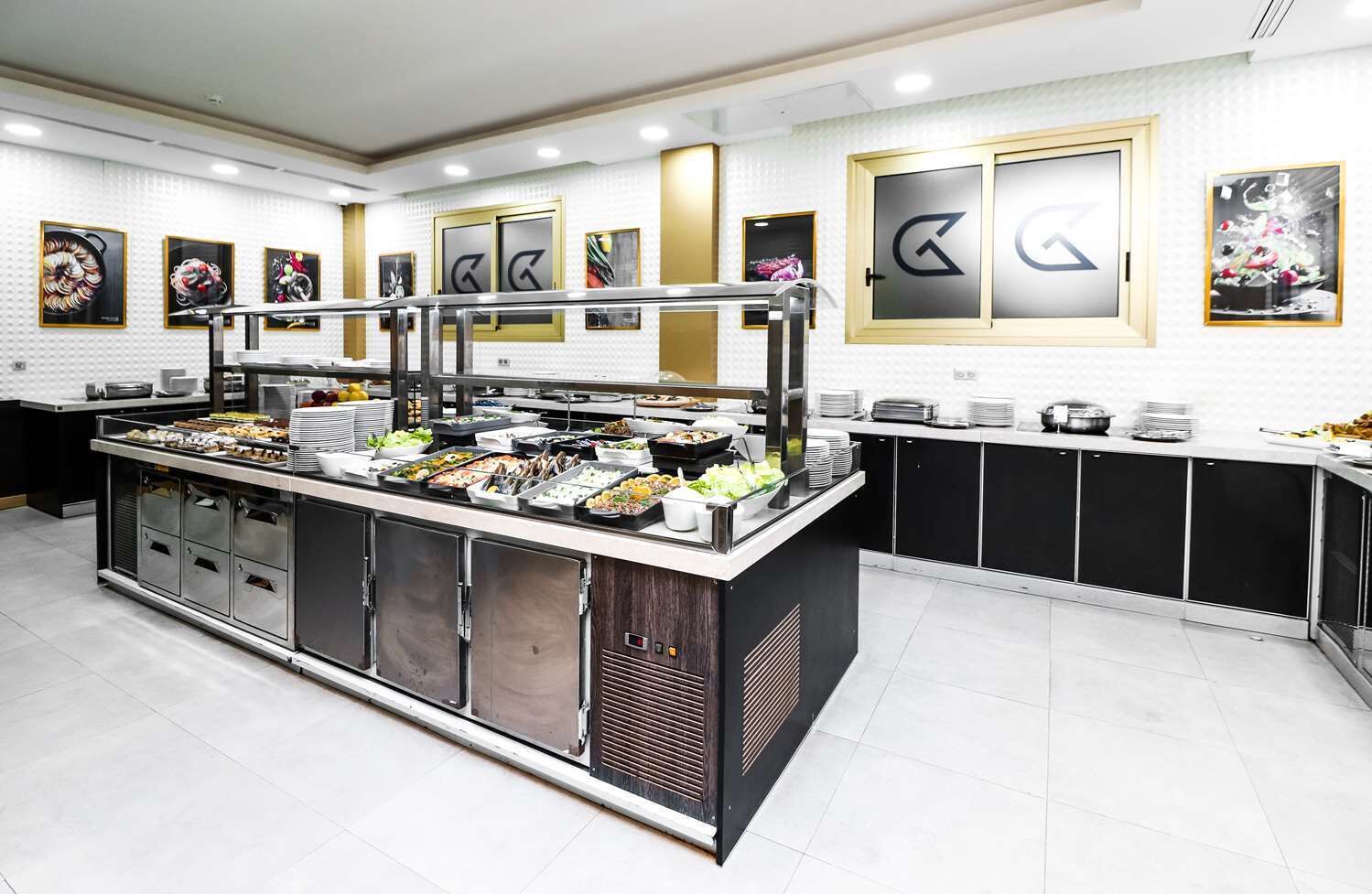 A buffet setup with various food items and a central serving station.