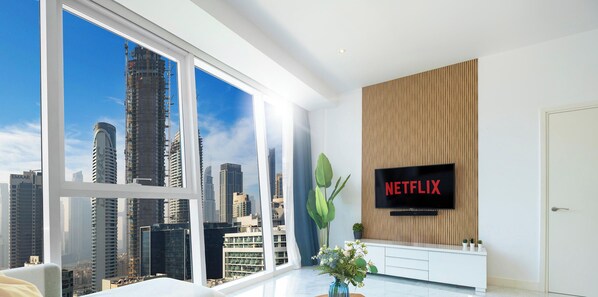 Deluxe Apartment, 1 Queen Bed with Sofa bed, Non Smoking, City View | Living area | 55-inch Smart TV with cable channels, TV