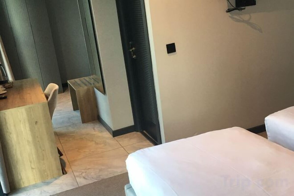 Hypoallergeen beddengoed, een minibar, een laptopwerkplek