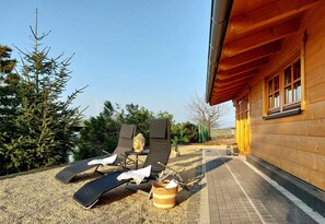Terrace/patio - Vacation home with garden, playground, whirlpool, wood-fired sauna, pet-friendly (Plütscheid)