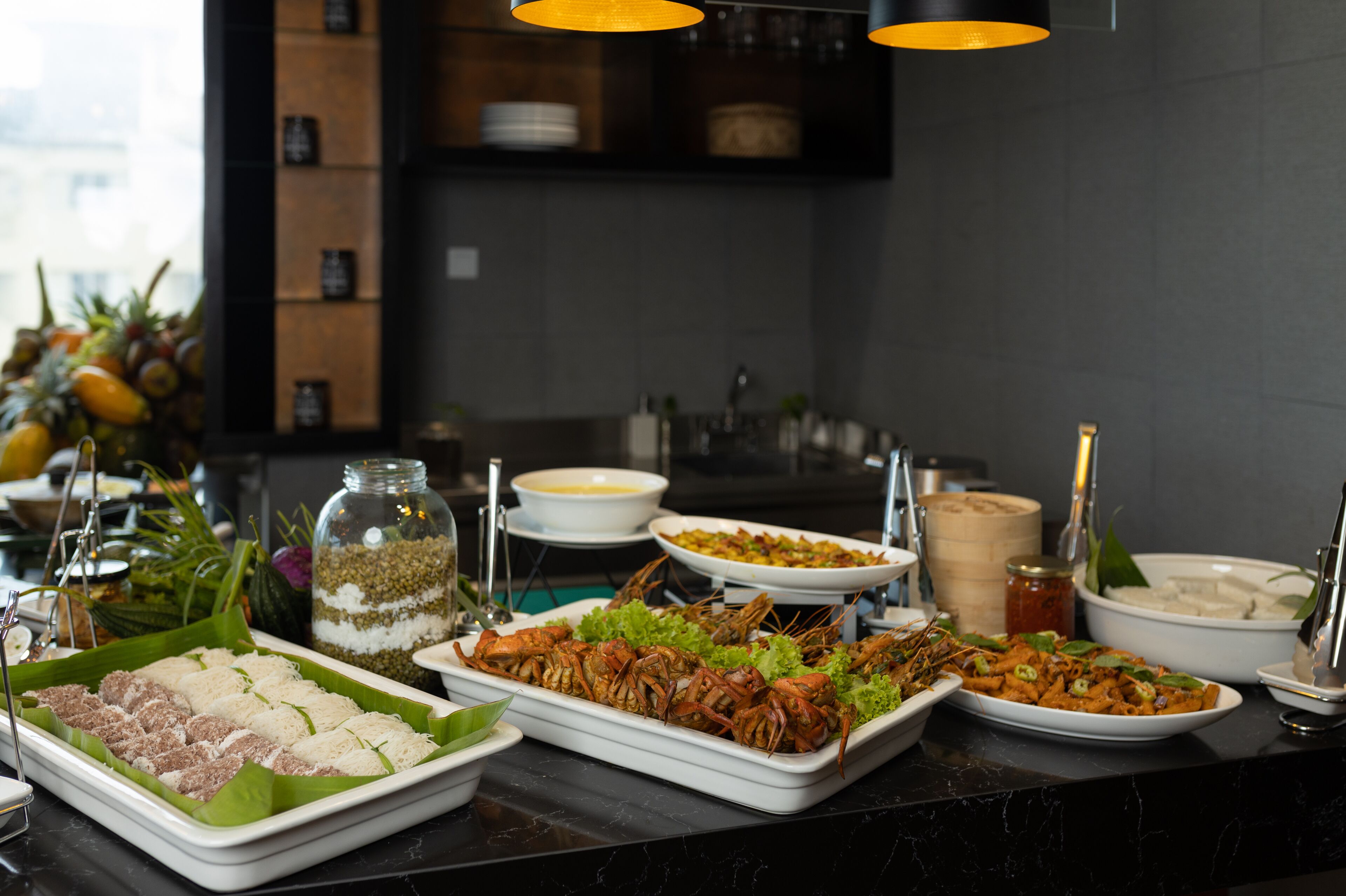 A buffet with various dishes including seafood, rice, and salads.