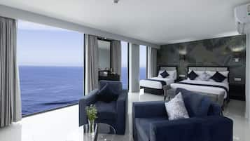 Habitación familiar, vista al mar | Ropa de cama hipoalergénica y minibar 