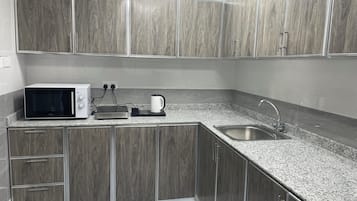 Full-sized fridge, microwave, electric kettle, freezer