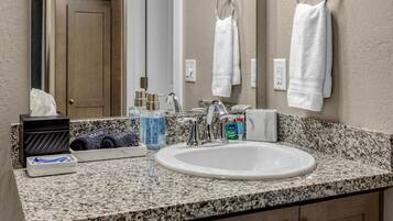 Combined shower/tub, hair dryer, towels, soap