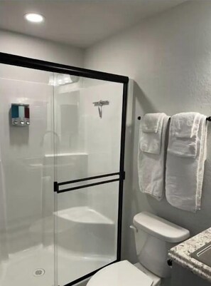 Shower, hair dryer, towels, soap