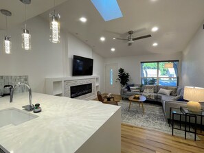 Smart TV, fireplace, books