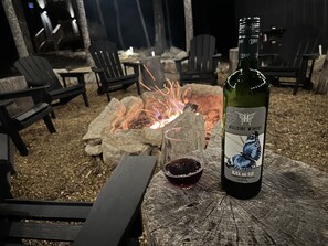 Enjoy a glass of wine by the fire!