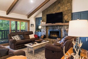 Smart TV, fireplace, foosball, books