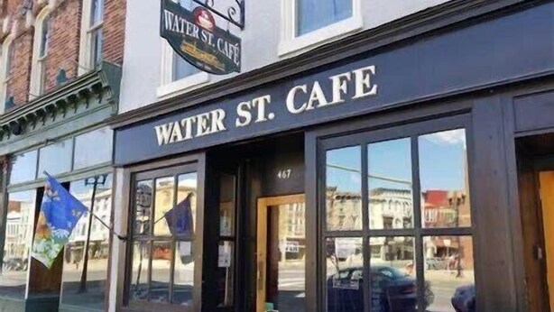 The exterior of Water St. Cafe with large windows and a sign above the entrance. - Spacious ‘GEM’ of the city (Geneva)