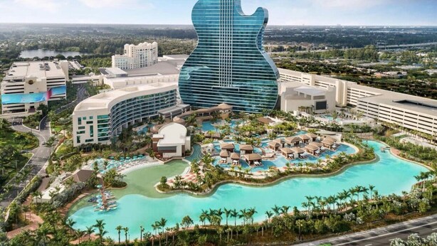 A resort with a guitar-shaped building, multiple swimming pools, and lush landscaping. - Fun House !¡ Come to Relax or Have Fun ☀️ (Sunrise)