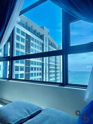 Comfort Suite | Living area | 35-inch LED TV with digital channels, TV, streaming services - Homesuite' Home at Jesselton Quay (Kota Kinabalu)