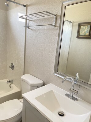 Combined shower/tub, hair dryer, towels, soap