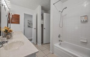Combined shower/bathtub, hair dryer, towels, soap