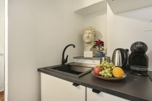 Fridge, stovetop, coffee/tea maker, cookware/dishes/utensils
