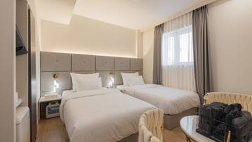 Chambre Deluxe avec lits jumeaux | Literie de qualité supérieure, couette en duvet d'oie