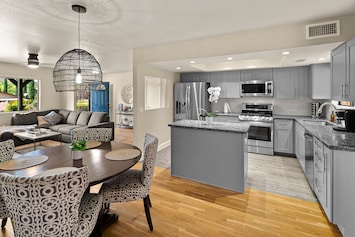Open living room, kitchen, and dining layout