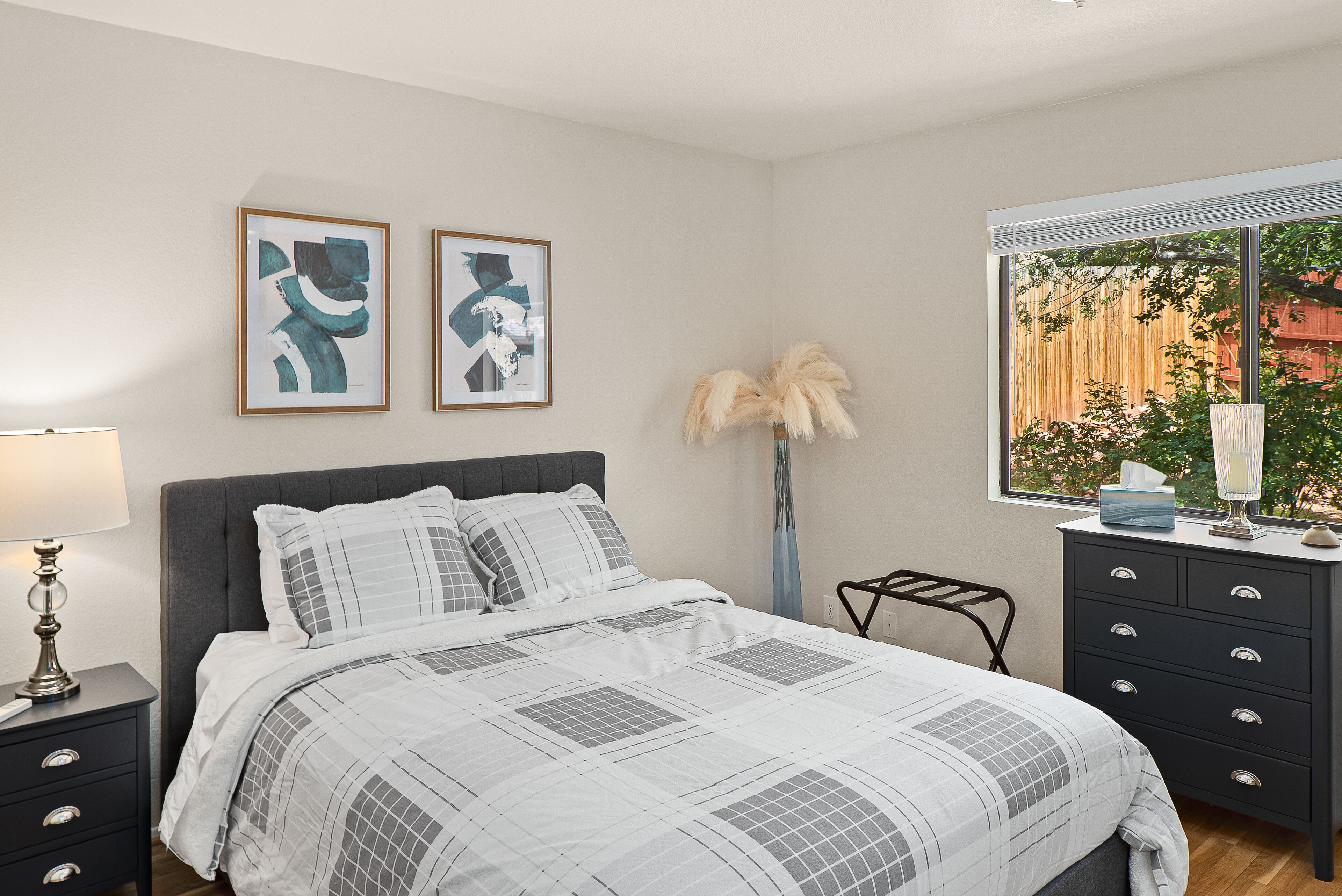 Bedroom number two with a queen bed and a new Sealy mattress