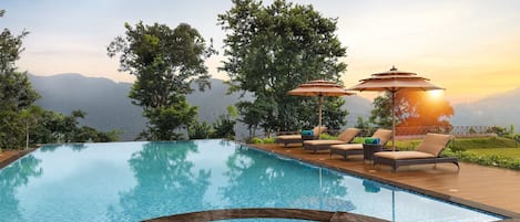 Outdoor pool, open 8:00 AM to 6:00 PM, pool umbrellas, sun loungers
