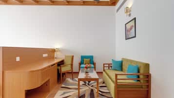 A modern living room with a wooden bench, a sofa, and a coffee table.