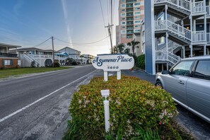 A sign for 'As Summer Place' with a number '5600' indicating the address.