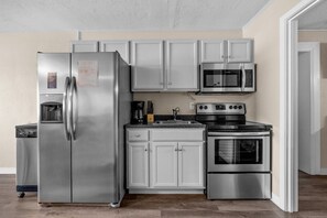 Fridge, microwave, cookware/dishes/utensils - Pet-Friendly Oceanfront 3-BR on Top Floor – Stunning Cherry Grove Beach Views - Blue Mist 302 (North Myrtle Beach)