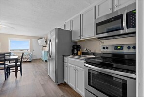 Fridge, microwave, cookware/dishes/utensils - Pet-Friendly Oceanfront 3-BR on Top Floor – Stunning Cherry Grove Beach Views - Blue Mist 302 (North Myrtle Beach)