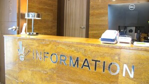 A reception desk with a marble top and the word "INFORMATION" prominently displayed. - Mt Seorak the East Sea and Hot spring (Sokcho)