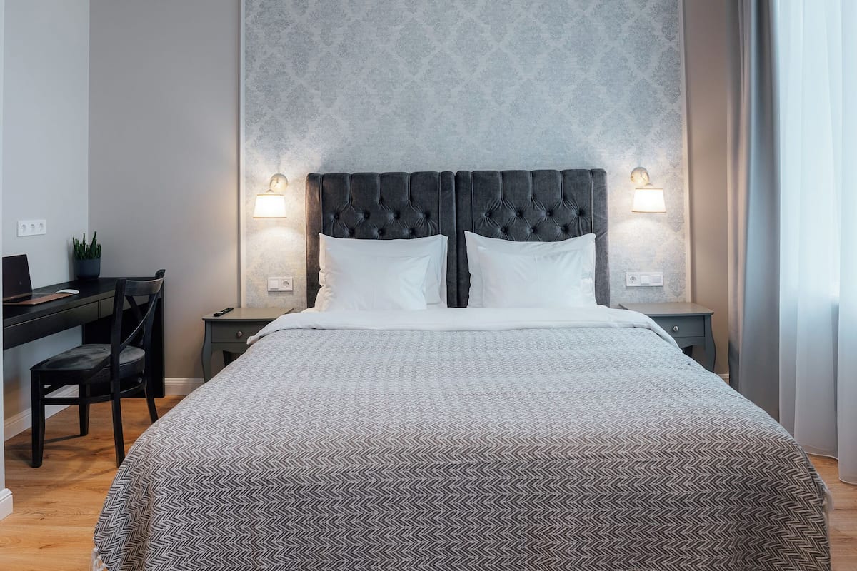 Familiekamer | Luxe beddengoed, een minibar, verduisterende gordijnen