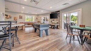A spacious indoor area with a pool table, foosball table, and a billiards table. - Great Lake Escape by PMR, 8BR Lakefront, Private Dock & Sun Deck, Sleeps 24 (Lake Harmony)