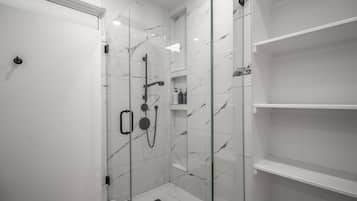 Shower, hair dryer, towels, shampoo