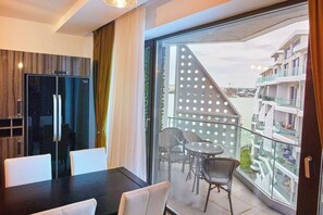 Comfort Apartment | Living area | 140-inch Smart TV with cable channels, TV
