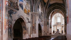 A church interior with high vaulted ceilings, detailed frescoes, and rows of pews. - Holiday Home 'I Colori di Civico 19' with Terraces & Wi-Fi (Galatina)
