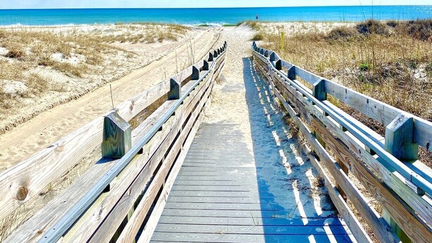 A wooden boardwalk leading to the beach with a clear sky. - Pet-friendly, 3 Blocks to Beach, Pool, #102 (Atlantic Beach)