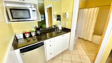 Coffee/tea maker, fridge, microwave, cookware/dishes/utensils