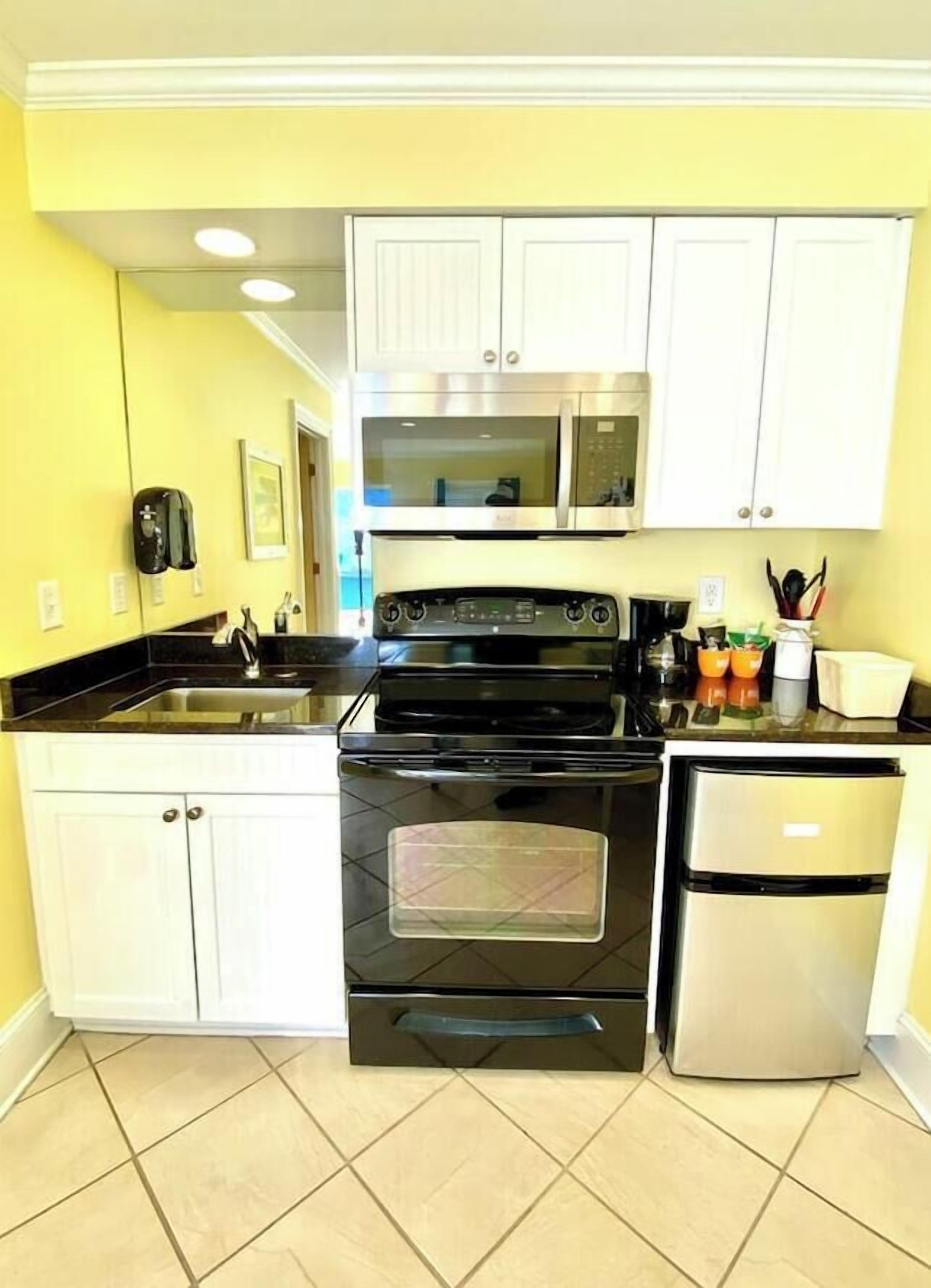 Coffee/tea maker, fridge, microwave, oven