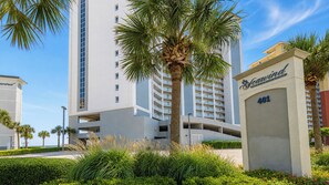 A high-rise building with a sign for 'Seavind Condominiums 401' indicating a residential complex. - Beautiful 3-Bedroom with a Balcony - Seawind 905 (Gulf Shores)