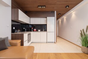 Apartment, 1 Bedroom, Balcony | Private kitchen | Dishwasher, coffee/tea maker, cookware/dishes/utensils