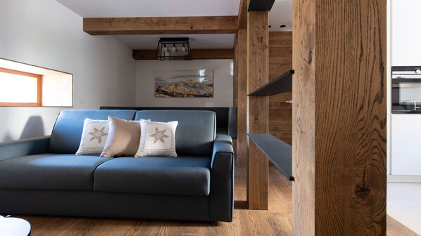 Luxury Apartment | Living area | 24-inch Smart TV with cable channels, TV