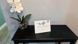 A black table with a sign that reads "wifi" and "network password" on it. - Fayetteville, NC, close to I-295 and Fort Bragg (Fayetteville)