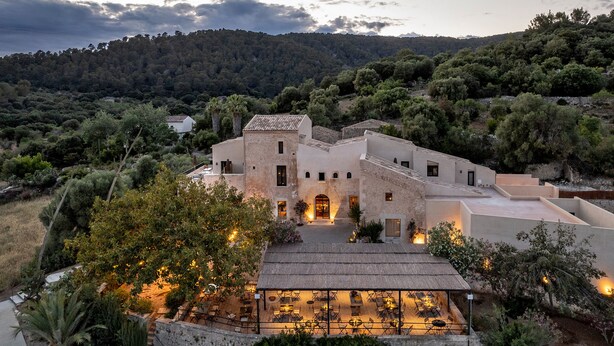 A large, rustic building with multiple rooms and a covered outdoor seating area. - The Lodge Mallorca - Small Luxury Hotels (Sa Pobla)