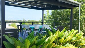 Outdoor dining - 1 Bedroom APT 2, Oceanview + Pool, Near Beach | @ Paradise Point Barbados (Oistins)