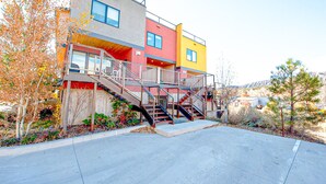 A multi-story building with a staircase leading to the upper floors. - Modern Townhouse on the River w/AC, Roof Top Deck (Durango)